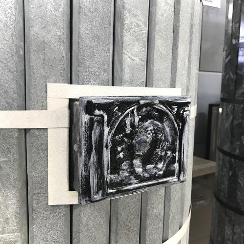 Decorative cast iron cleanout door for Siberia model featuring a bear relief sculpture with a distressed antique silver finish.