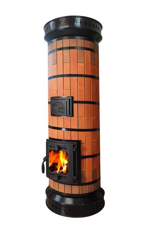 Angled view of Tundra red brick masonry heater with fire burning in the glass firebox