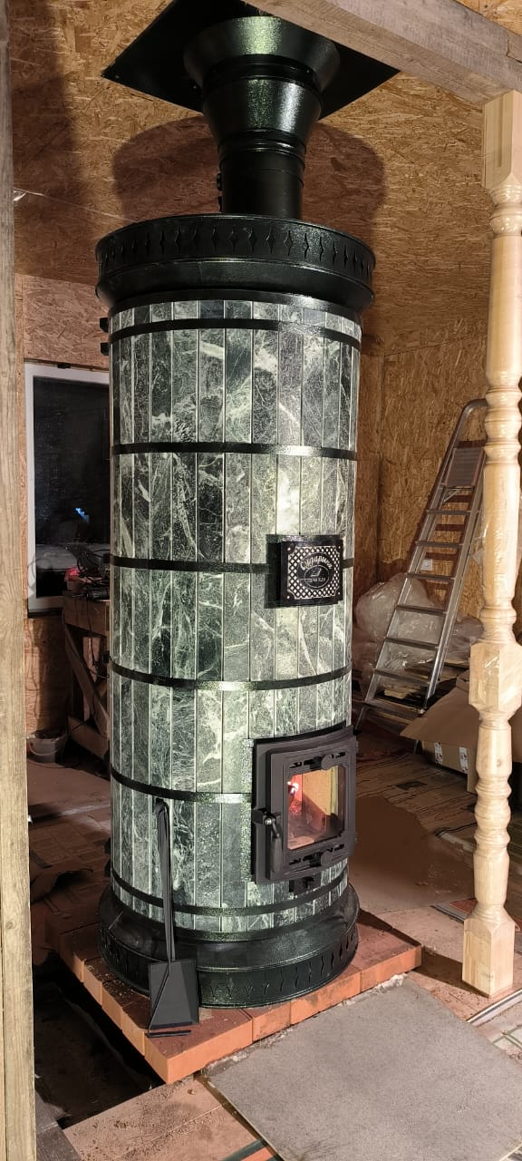 Siberia Wood-burning masonry heater with decorative design in a room setting