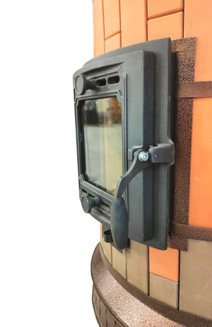 Side profile close-up of the Siberia red brick masonry heater, showing the two-tone brick texture and antique bronze-finish steel banding.