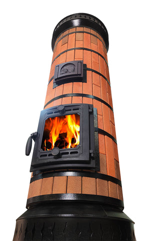 Low angle view of tall red brick masonry heater, emphasizing vertical heating surface