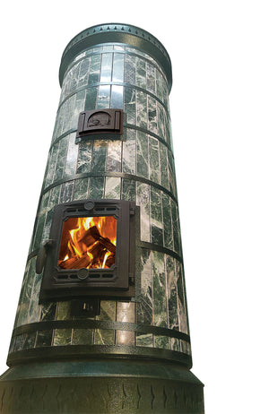 Low-angle view of the cylindrical Siberia green stone masonry heater, emphasizing the polished serpentine finish and decorative steel rings.