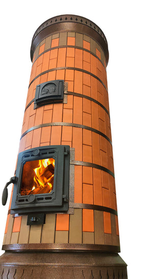 Low-angle view of the cylindrical Siberia red brick masonry heater, emphasizing its high thermal mass capacity and decorative copper-colored trim rings.